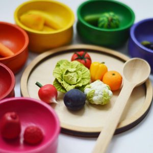 Sorting set with 7 wooden bowls, plate, spoon and 21 miniature vegetables and fruits